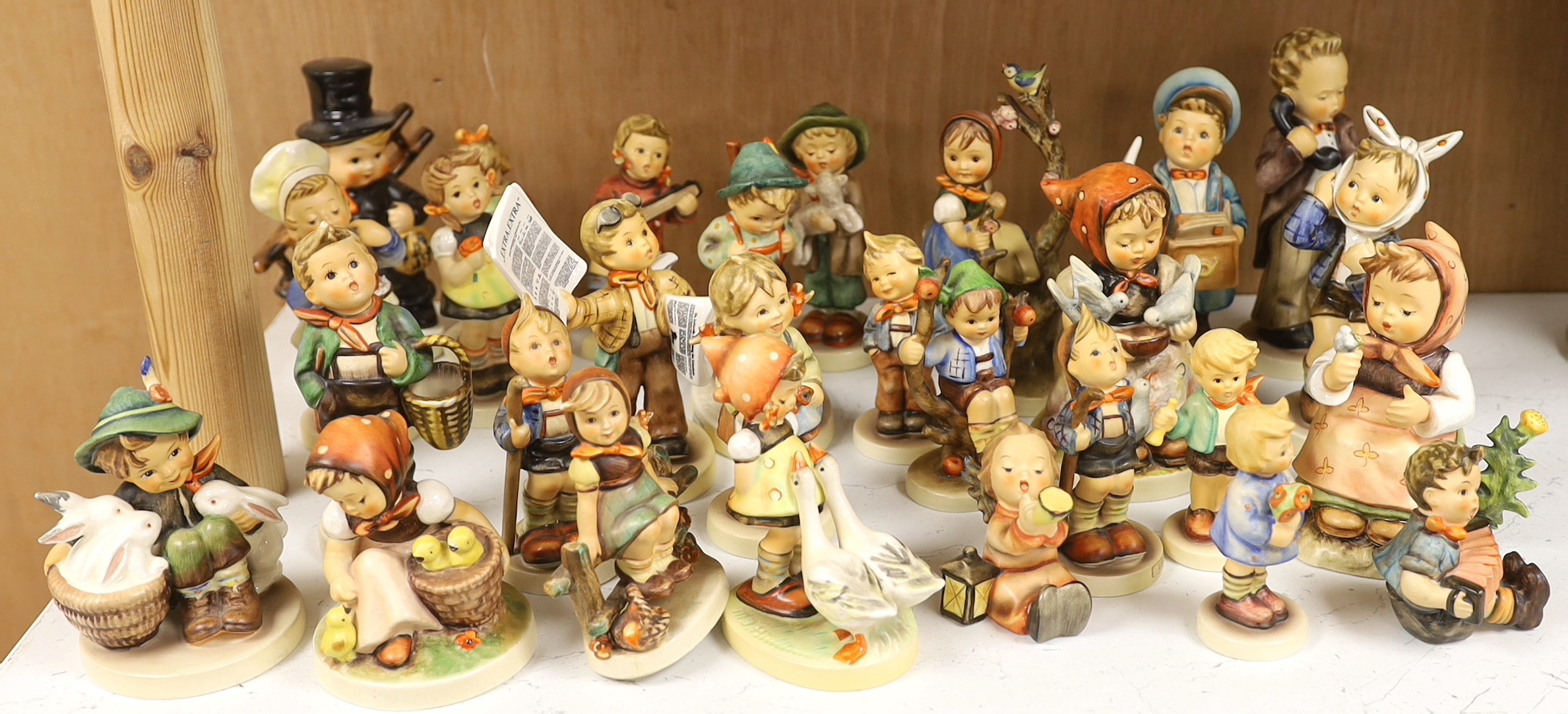 Twenty eight Goebel Hummel figures, largest 15cm high